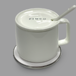 Heating cup with wireless charger pad